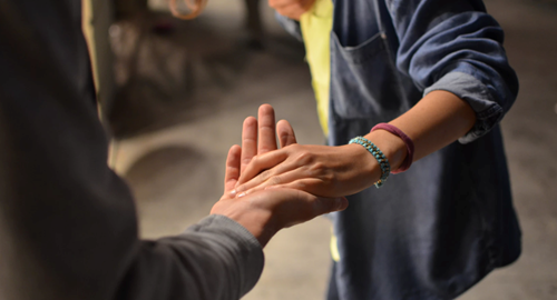 2 people holding hands